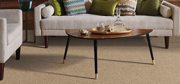 Light colored carpet flooring in the living room, products by Flooring America of Grand Rapids